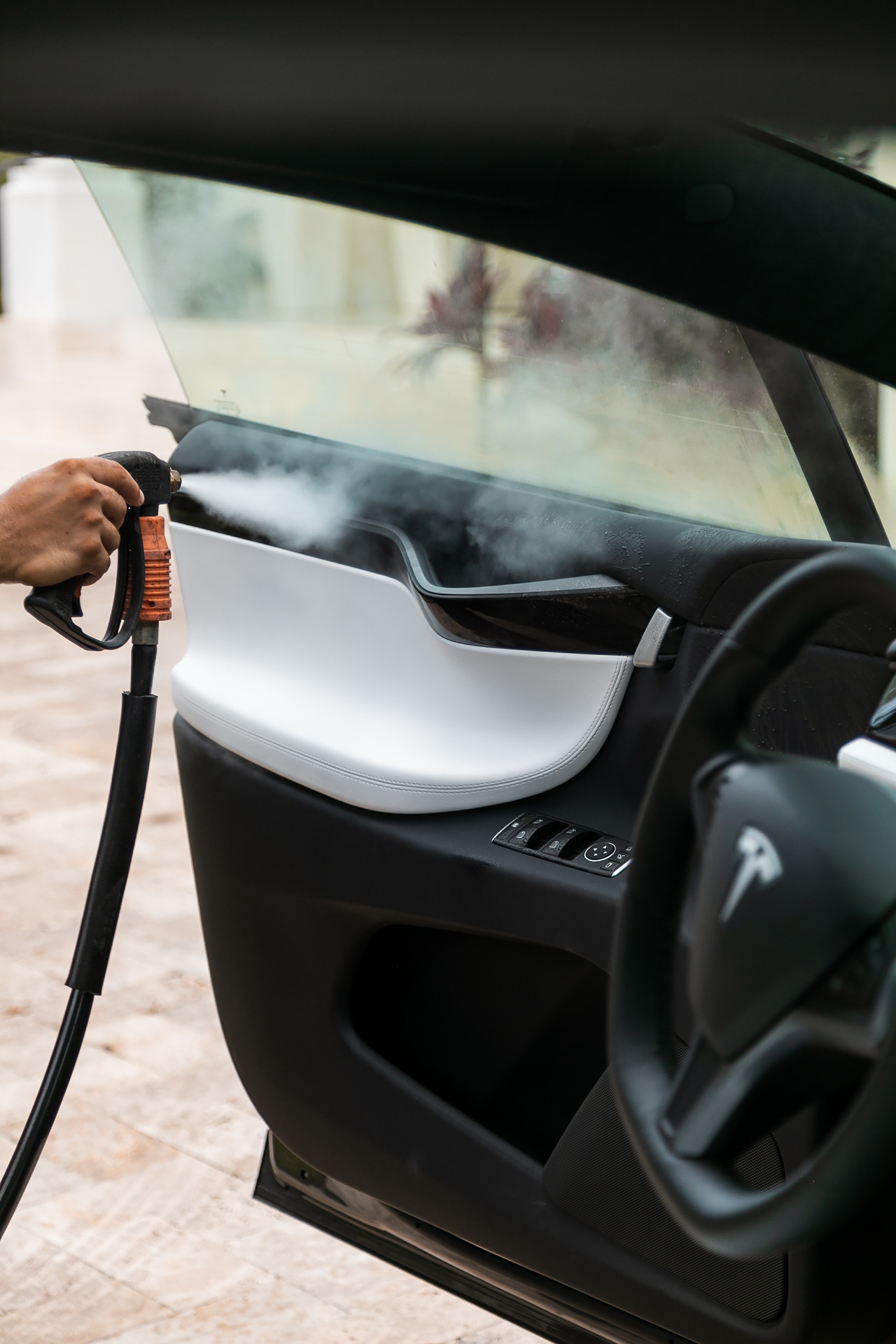 tesla door panel steam cleaning